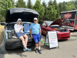 EV owners talk about driving electric at a 2024 Loveland Farmers Market